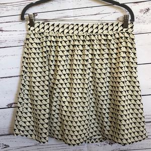 Dina Be ivory mini flounce skirt with‎ black flying ducks geese size L